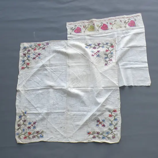 Two square embroidered Turkish cloths.